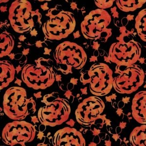 an image of black fabric with a pattern of tossed orange jack-o'-lanterns