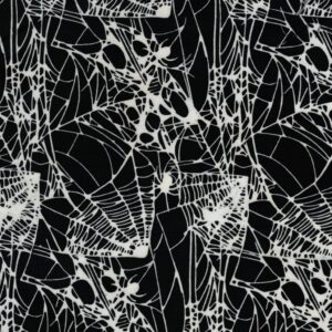 an image of black fabric with a pattern of white spider webs and spiders