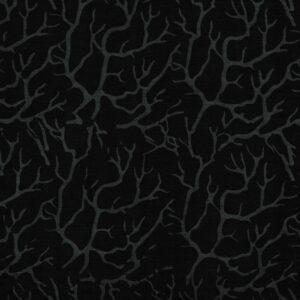 an image of black fabric with a pattern of dark gray branches