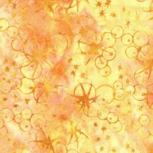 an image of yellow and gold batik fabric with a pattern of scattered sea urchin outlines