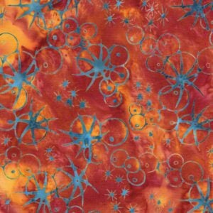 an image of orange batik fabric with a pattern of scattered sea urchin outlines in teal