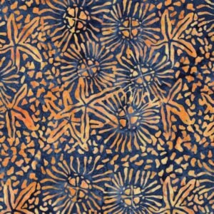 an image of dark blue batik fabric with a pattern of scattered starfish outlines in orange and yellow