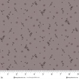 an image of gray fabric with a light checkboard background and a pattern of tossed thistles