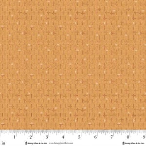 an image of gold yellow fabric with a geometric pattern of sets of 4 small dots