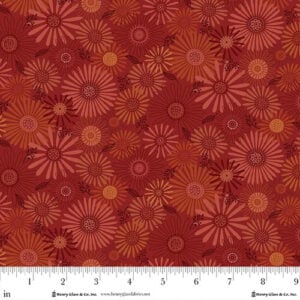 an image of red fabric with an all-over print of daisies
