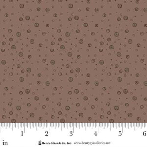 an image of dusty brown or taupe fabric with an all-over print of small darker dots and circles