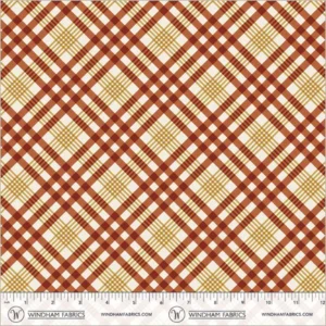 an image of white fabric with a pattern of red and gold plaid that runs diagonally to the selvedge