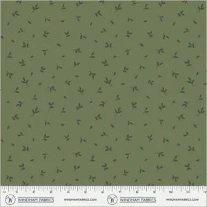 an image of green fabric with a pattern of tossed small darker green leaves