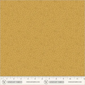 an image of yellow fabric with a pattern of tossed small irregular triangles