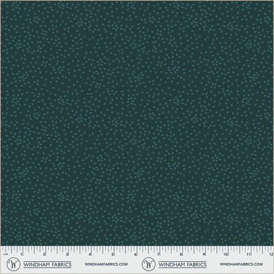 an image of dark teal fabric with a pattern of tossed small irregular triangles