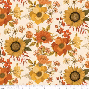 an image of cream fabric with a pattern of tossed sunflowers, poppies, and other flowers