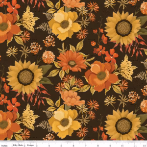 an image of brown fabric with a pattern of tossed sunflowers, poppies, and other flowers