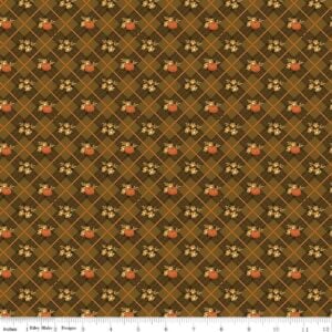 an image of brown colored fabric with a pattern of diagonal plaid and small pumpkins in orange and gold