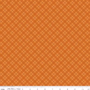 an image of orange fabric with a pattern of diagonal plaid