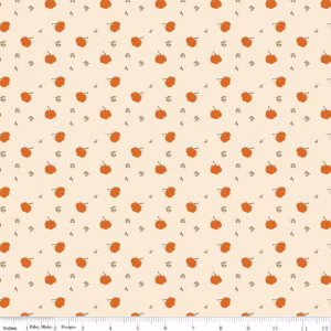 an image of cream colored fabric with a pattern of tossed orange pumpkins