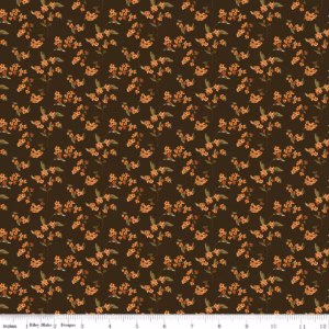 an image of brown fabric with a pattern of tossed sprigs of bittersweet