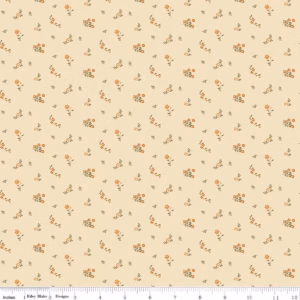 an image of cream colored fabric with a pattern of tossed floral sprigs