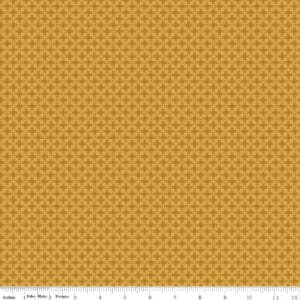 an image of golden yellow fabric with a geometric grid pattern of petals and diamonds