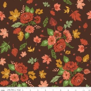 an image of brown fabric with a pattern of tossed clusters of leaves and flowers in rust, coral, and gold