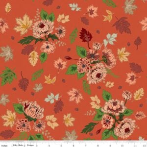an image of orange fabric with a pattern of tossed clusters of leaves and flowers in rust, coral, and gold