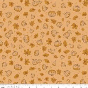 an image of golden brown fabric with a pattern of tossed pumpkins and fall leaves