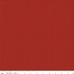an image of rusty red fabric with a houndstooth pattern