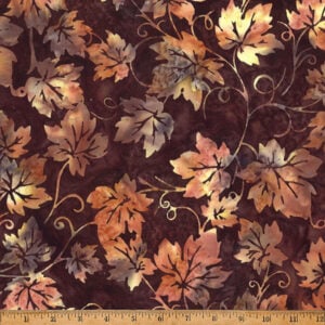 an image of brown fabric with a pattern of grape leaves and vines in lighter brown and gold