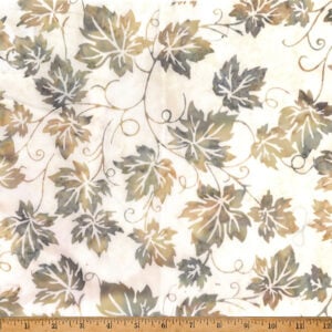 an image of cream fabric with a pattern of gold and green grape vines and leaves