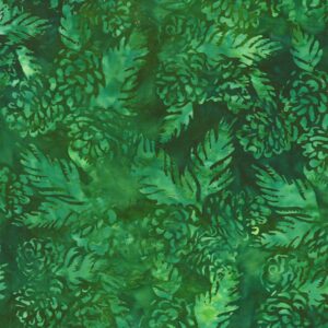 an image of green fabric with a pattern of tossed pine cones and pine sprigs