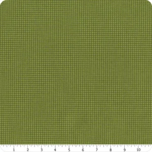 an image of green fabric with a houndstooth pattern