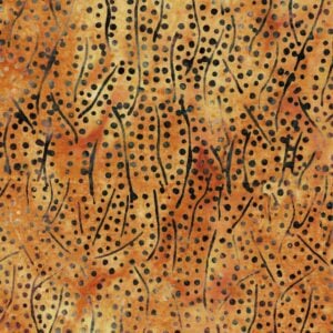 an image of caramel brown fabric with a pattern of scattered lines and dots