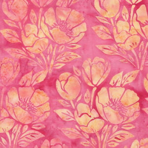 an image of pink batik fabric with a directional print of yellow poppies and leaves