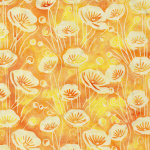 an image of variegated yellow batik fabric with a directional pattern of medium sized poppies