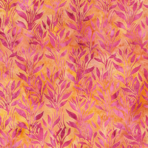 an image of yellow and orange batik fabric with a pattern of pink vines and leaves