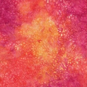 an image of dark pink, yellow, and orange batik fabric with a pattern of small yellow dots and squiggles