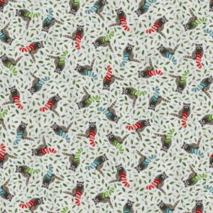 an image of light gray fabric with a pattern of tossed holly leaves and raccoons knitting Christmas stockings
