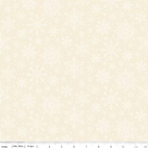 an image of cream colored fabric with a pattern of tossed white snowflakes