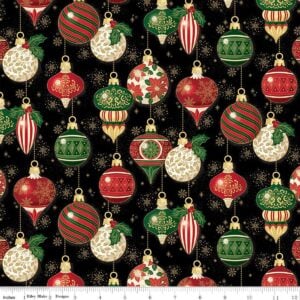 an image of black fabric with a pattern of round and oblong old fashioned tree ornaments in red and green with gold foil accents