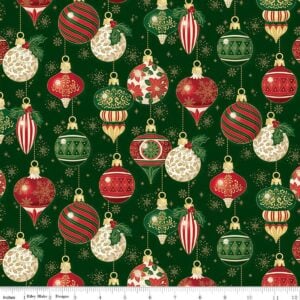 an image of green fabric with a pattern of round and oblong old fashioned tree ornaments in red and green with gold foil accents