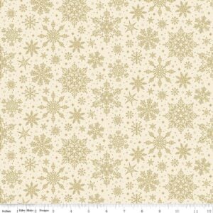 an image of cream colored fabric with a pattern of tossed gold foil snowflakes