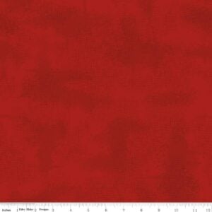 an image of red fabric with an allover pattern of crosshatching and small black flecks