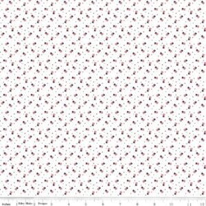 white fabric with small scattered United States flags in red and blue