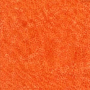 an image of orange batik fabric with an allover pattern of small triangles