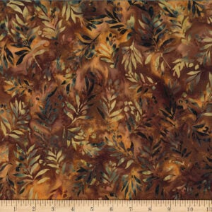 an image of brown and gold batik fabric with a leafy pattern