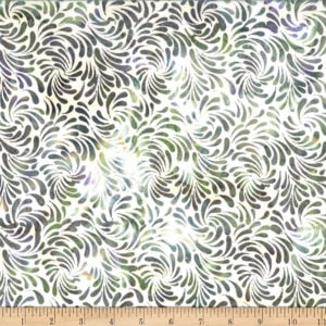 batik fabric with a white background and an allover pattern of swirled petal shapes in green and purple