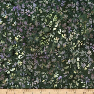 batik fabric with a dark green background and an allover pattern of purple and green leaves